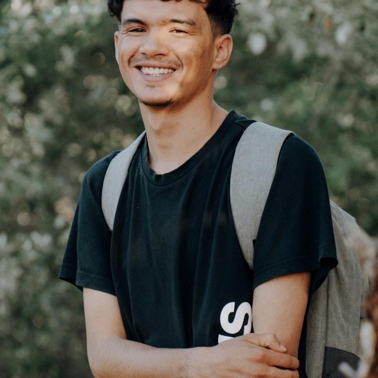 Alex Rivera, Lead Design Curator at Modern System Framework, reviewing corporate floral arrangements